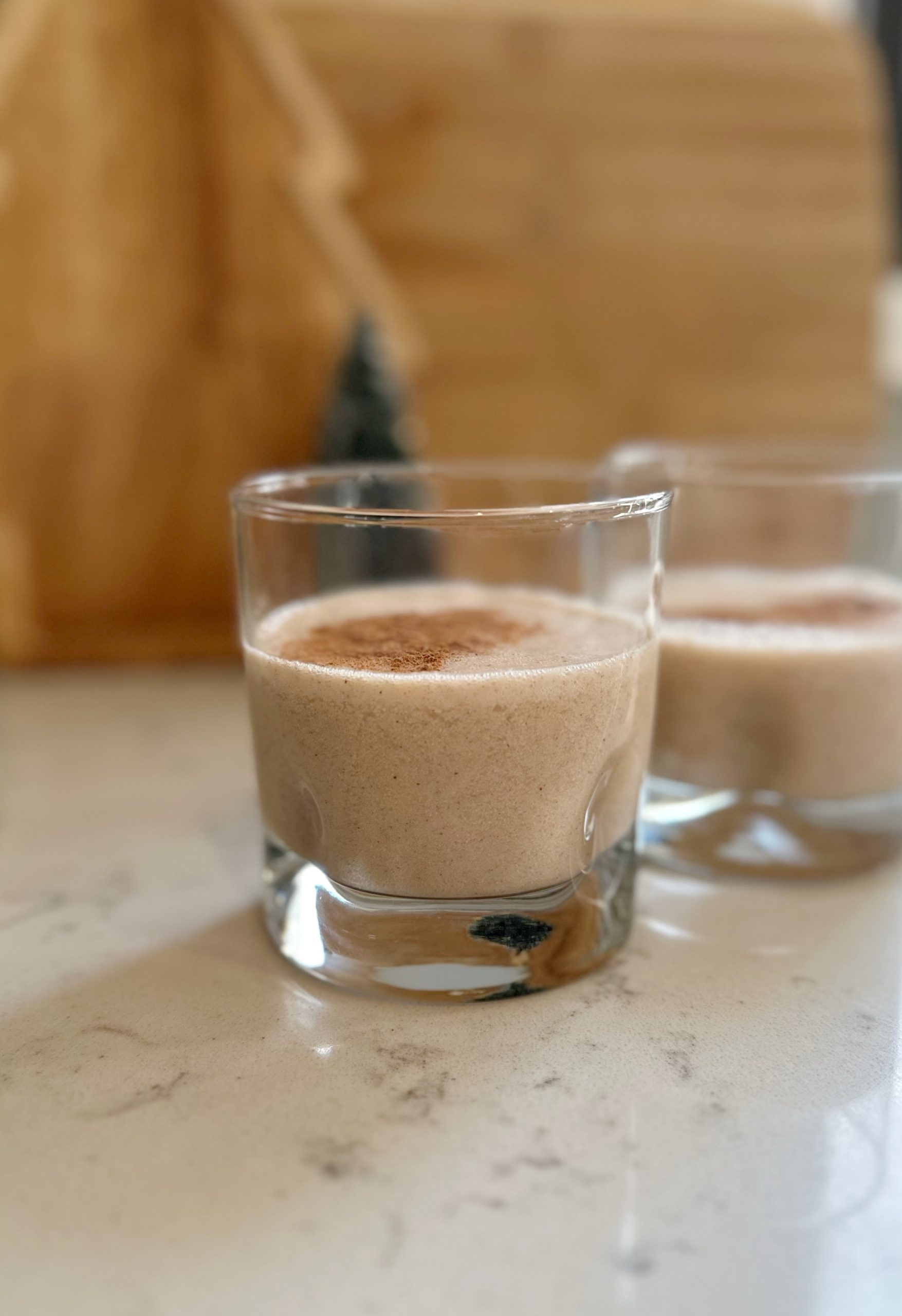 Two Large Glasses Of Eggnog Served Beautifully Stock Photo